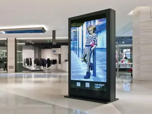 A freestanding portrait display in a bright commercial lobby